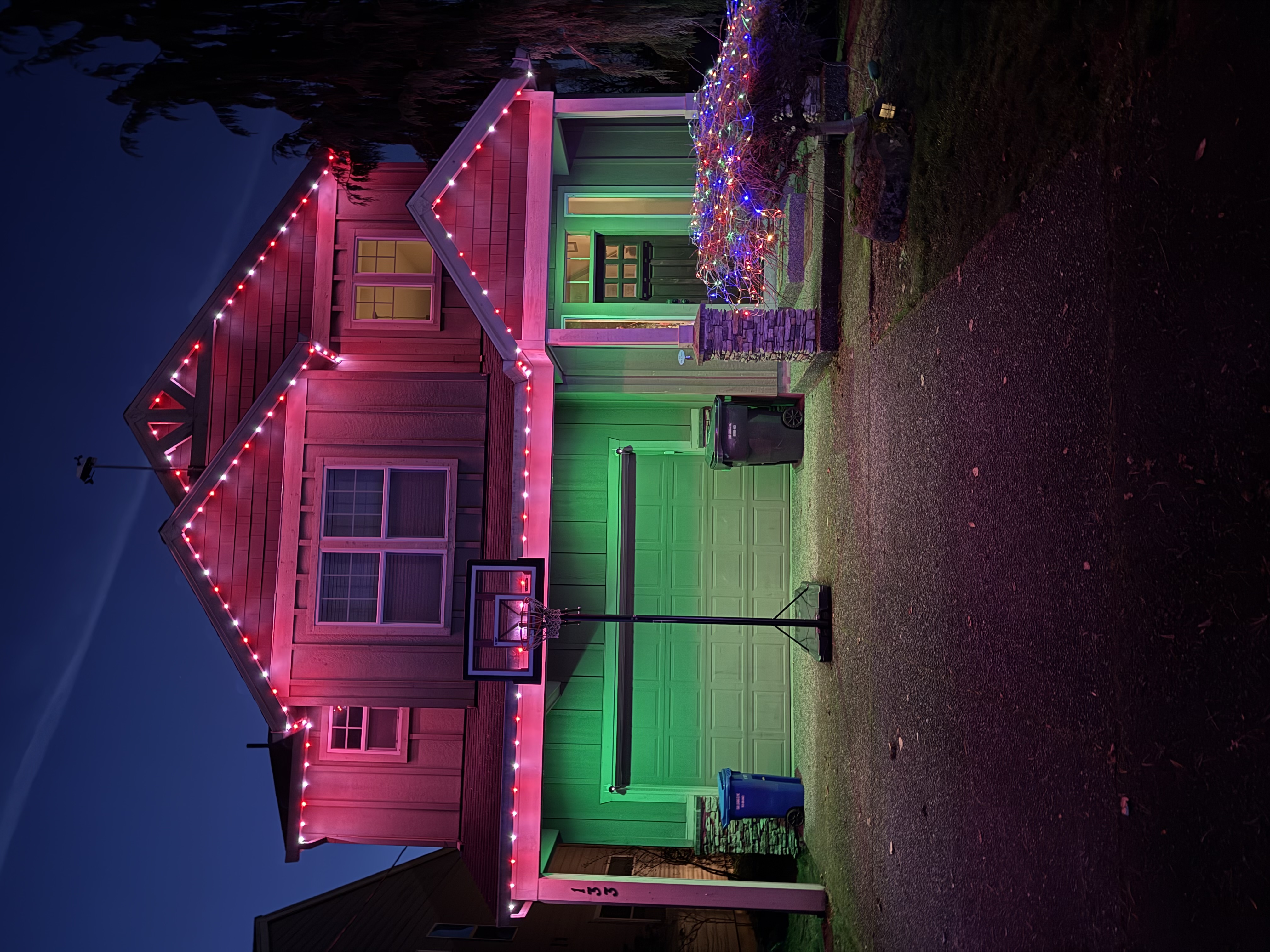 Two-story home lit at dusk